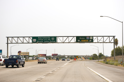 highway signs pointing to Sacramento and Reno