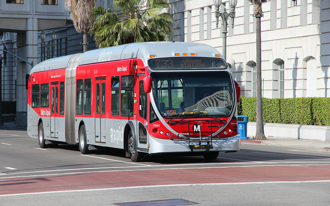 bus on a road with buildings